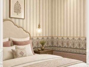 Neutral striped wallpaper with decorative Indian border.