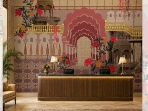 Traditional Indian heritage mural wallpaper featuring grand palace arches, domes, floral vines, and intricate geometric patterns in warm blush, beige, and burgundy tones, designed as a luxurious backdrop for hotel receptions, lobbies, and statement interiors.
