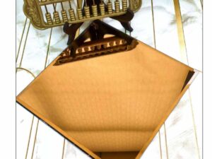 golden decorative sheet with a subtle textured pattern displayed on a sample board.