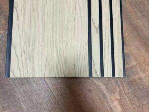 Cream white wood-texture fluted wall panel with vertical grooves and a minimalist design