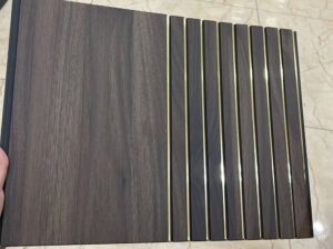 Dark brown wooden fluted panel with elegant golden strips for interior wall decoration