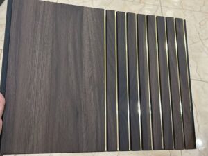 Dark brown wooden fluted panel with elegant golden strips for interior wall decoration