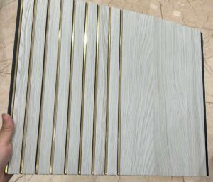 White wood-textured fluted panel with gold accent lines